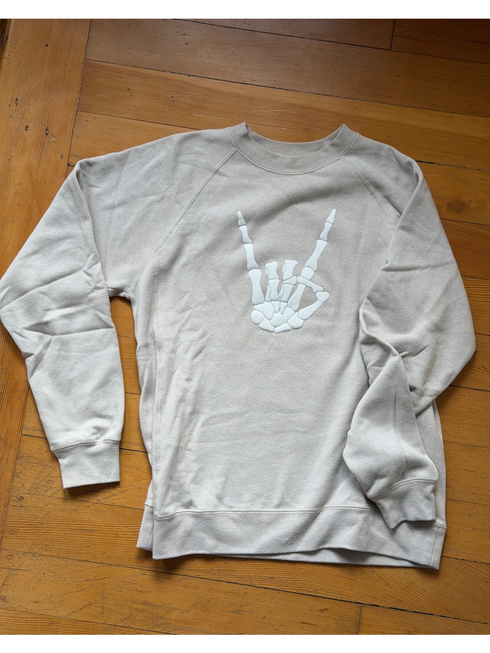 Neutral Beige Sweatshirt with White Skeleton Hand Graphic